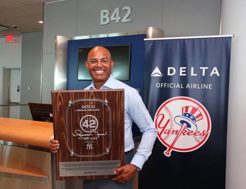 Mariano Rivera holding the Gate 42 commemorative plaque designed by Rondell Cadette