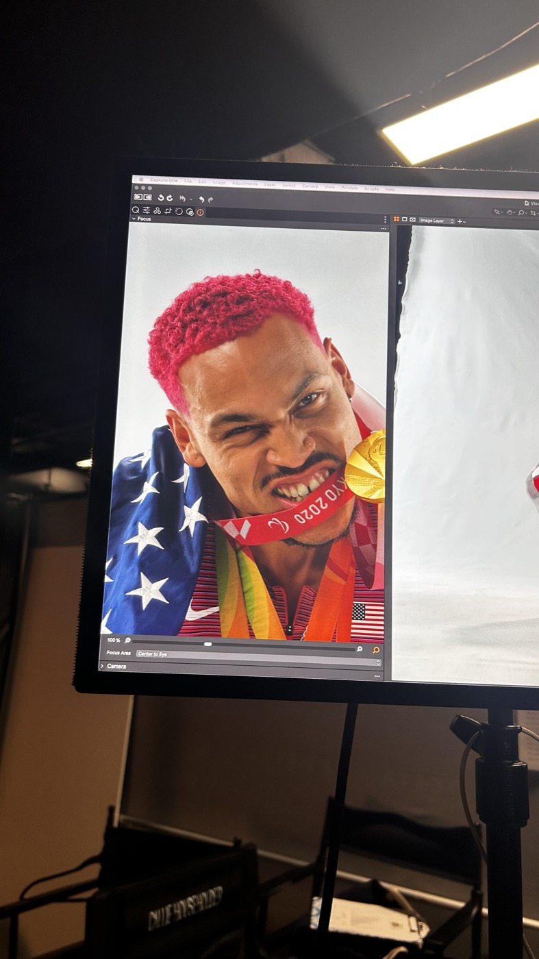 On-set capture monitor showing an athlete portrait with medals and a flag